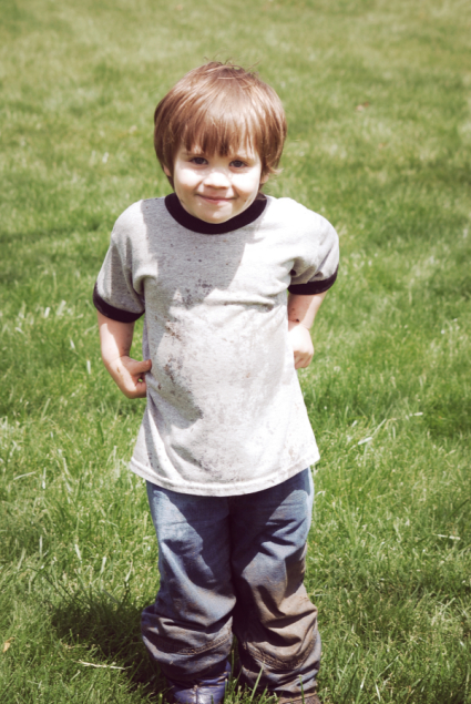 Little Boy Playing in the Dirt and Sunshine