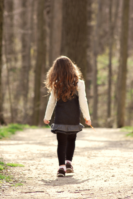 Child Walking in the Woods