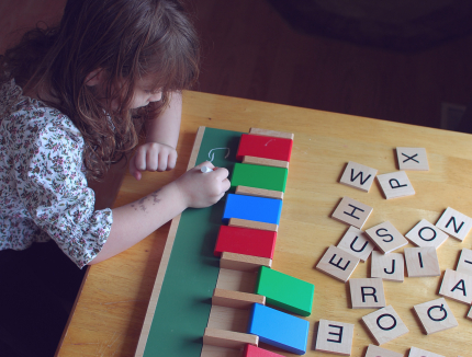 Spelling Words with Wooden Letter Tiles