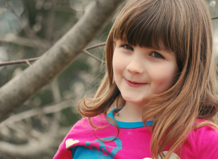 Smiling Child Playing Outside