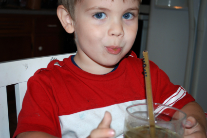Drinking a Green Smoothie Through a Glass Straw