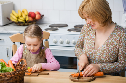 Mother and daughter prepare meal